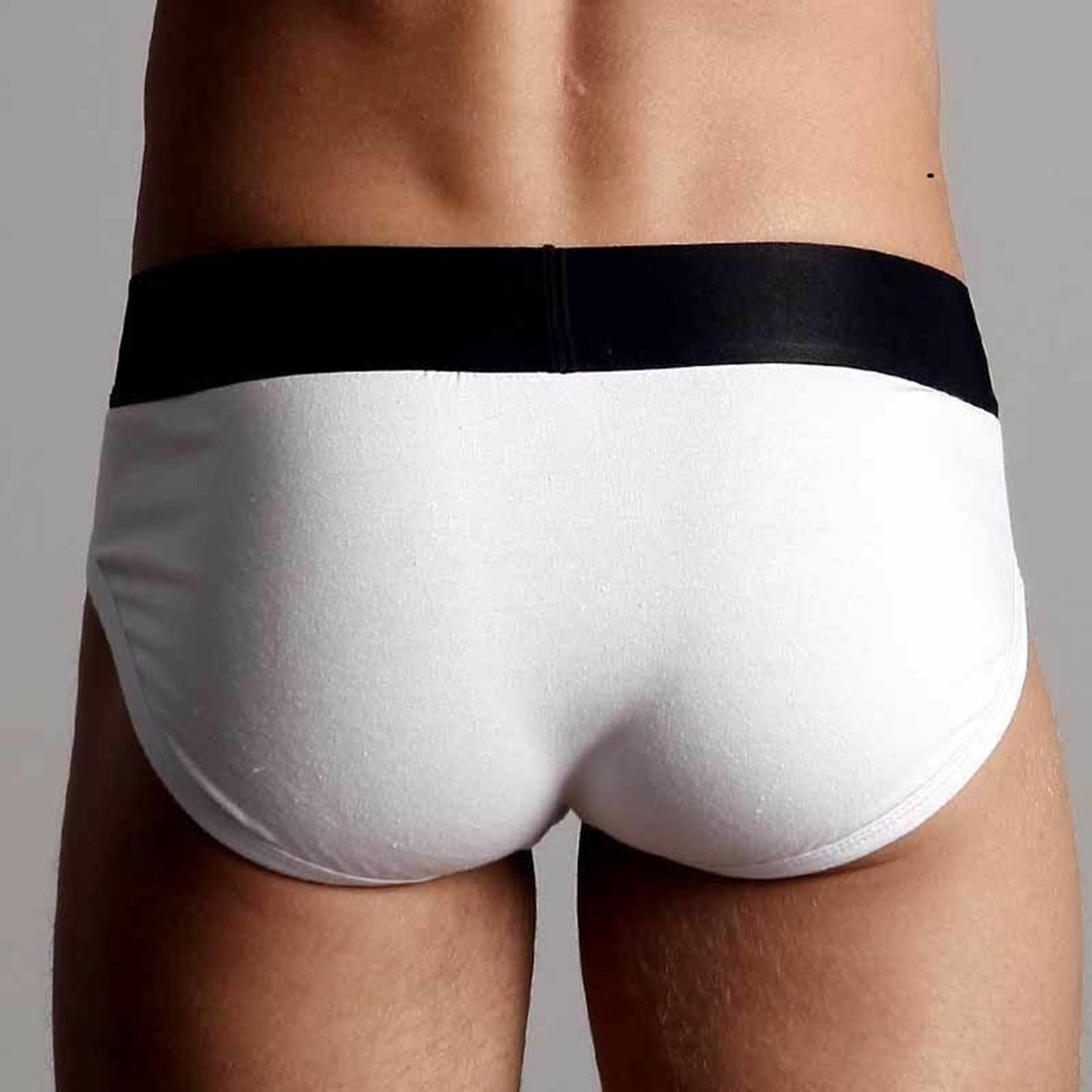 Мужские трусы брифы белые с черной резинкой Calvin Klein фото 4