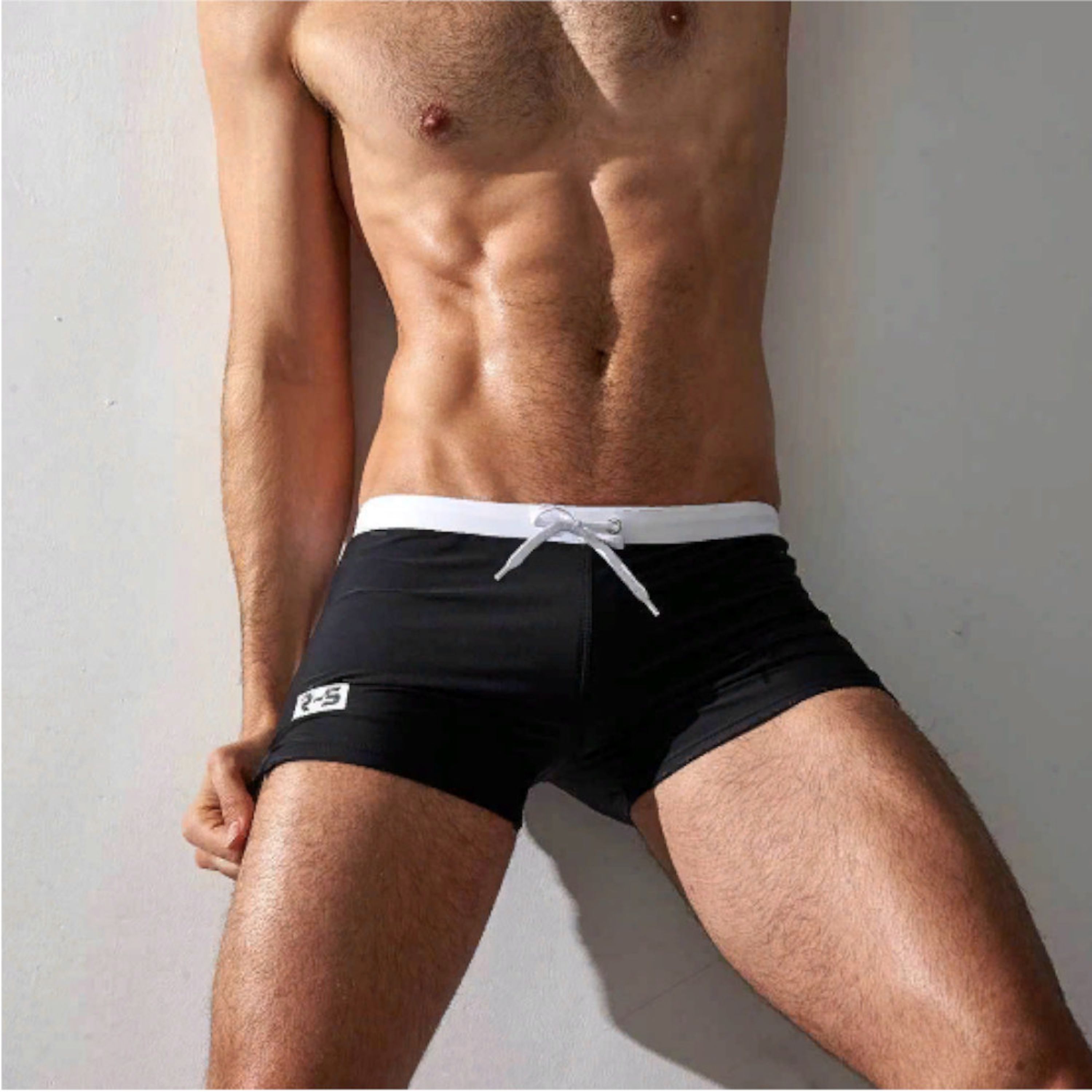 Мужские плавки черные с белой резинкой оранжевым карманом сзади Aqux фото 1