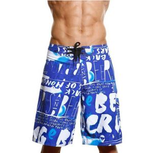 Фото Мужские пляжные шорты Quiksilver синие с принтом надпись 