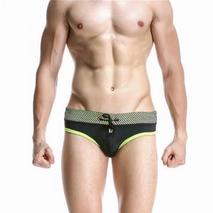 Фото Мужские плавки брифы черные с зеленой окантовкой Seobean