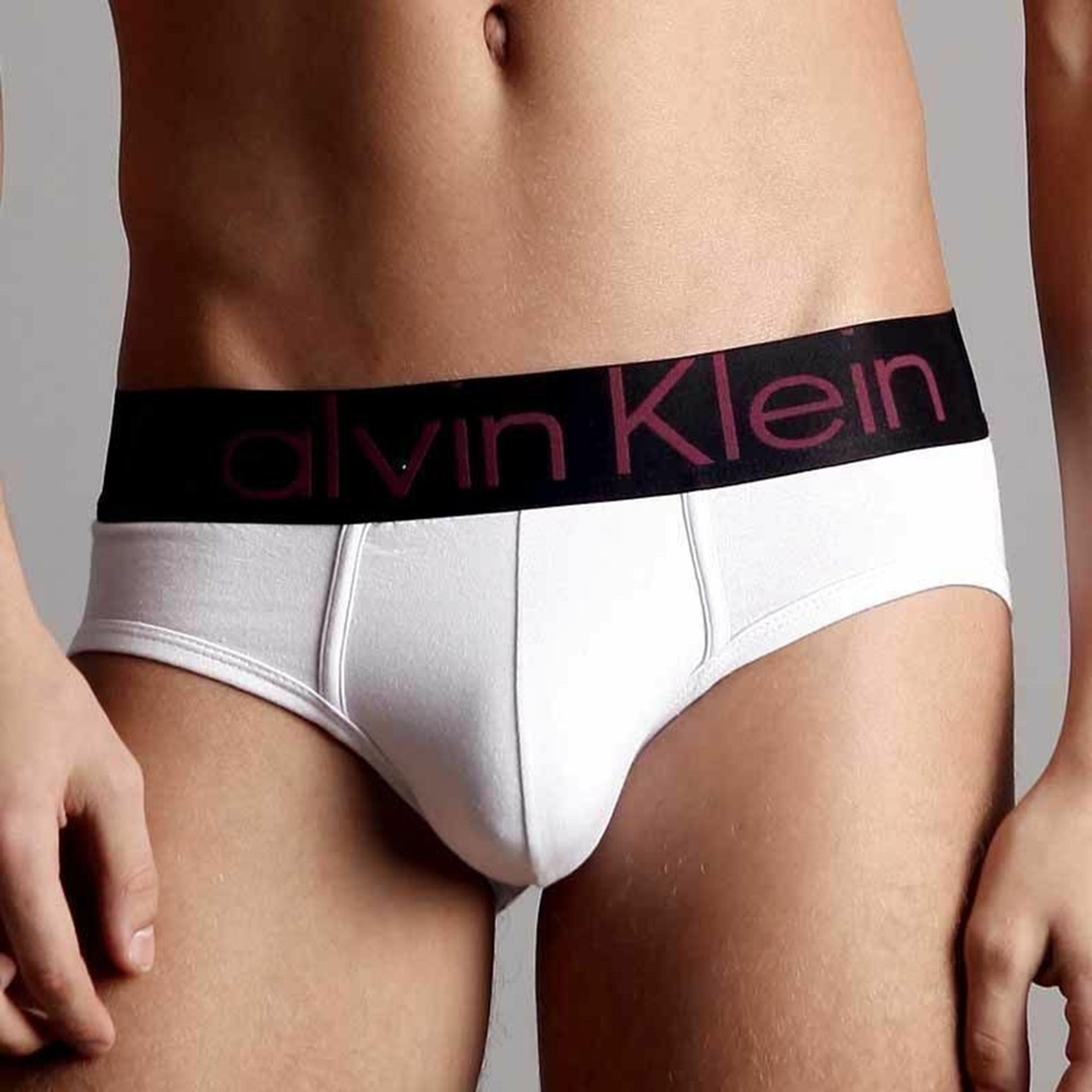 Мужские трусы брифы белые с черной резинкой Calvin Klein фото 2