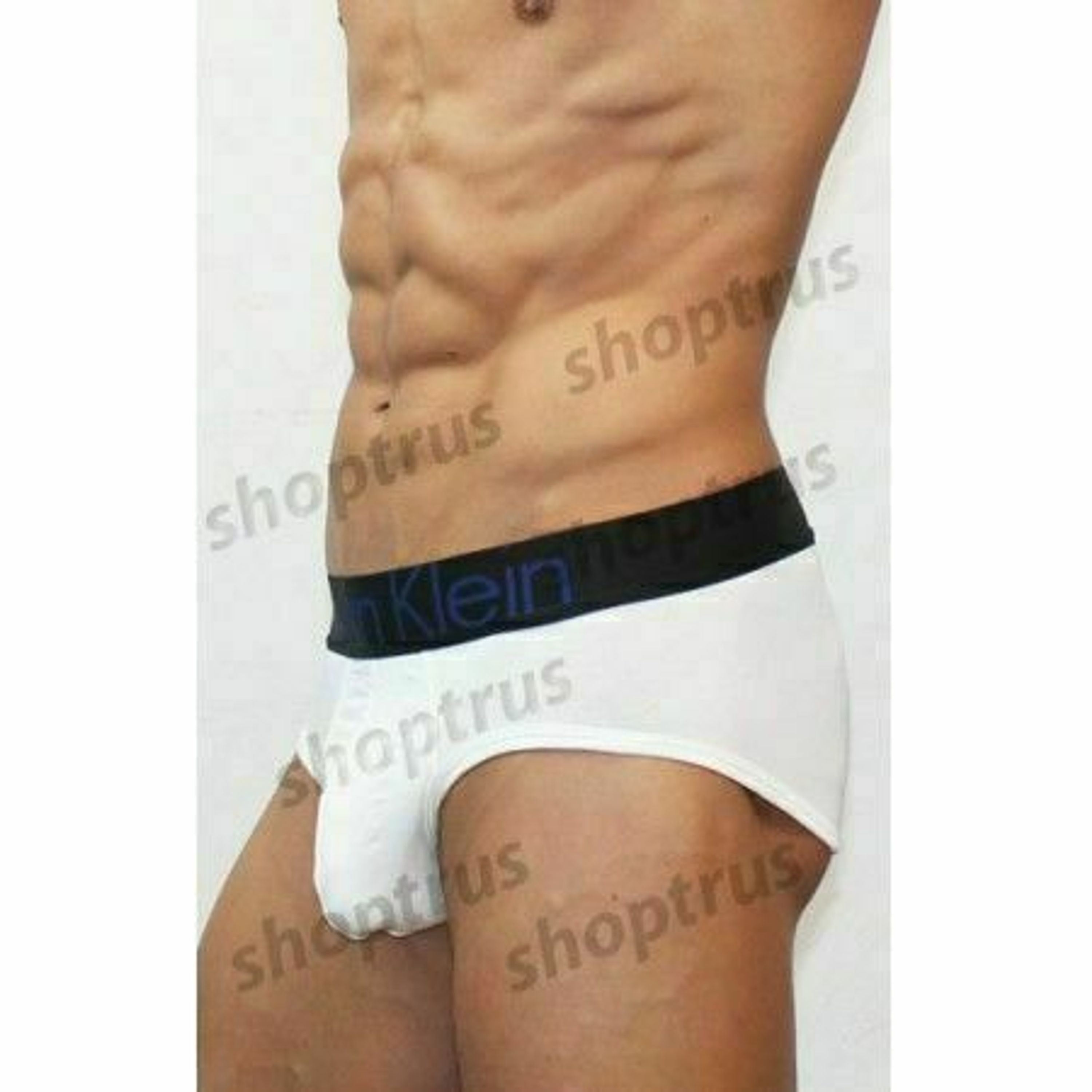 Мужские трусы брифы белые с черной резинкой Calvin Klein фото 2