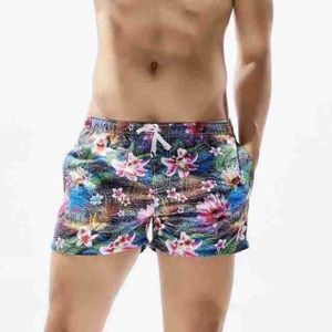 Фото Мужские пляжные шорты синие с цветочным принтом SEOBEAN 30235