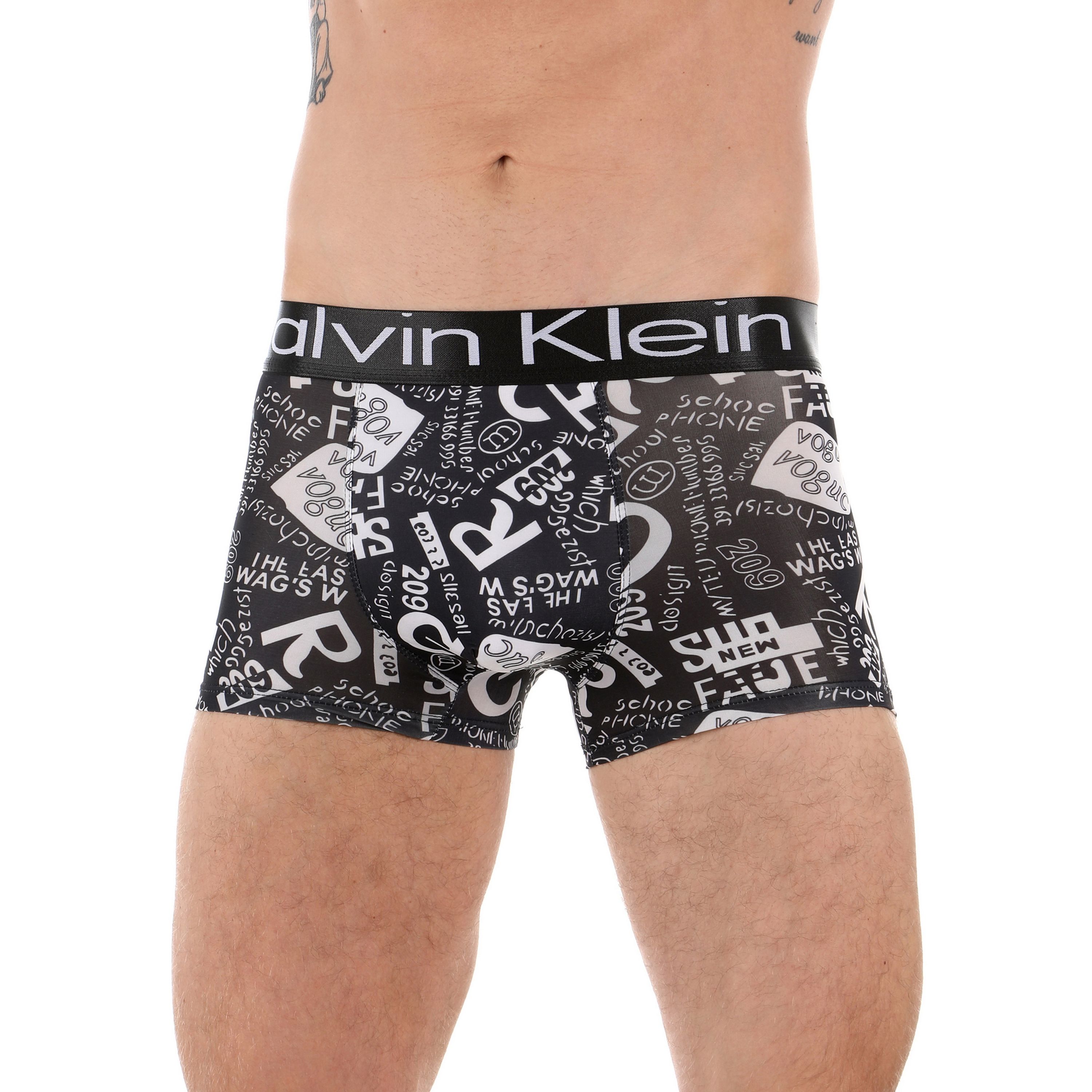 Мужские трусы боксеры черные с белыми надписями Calvin Klein фото 1