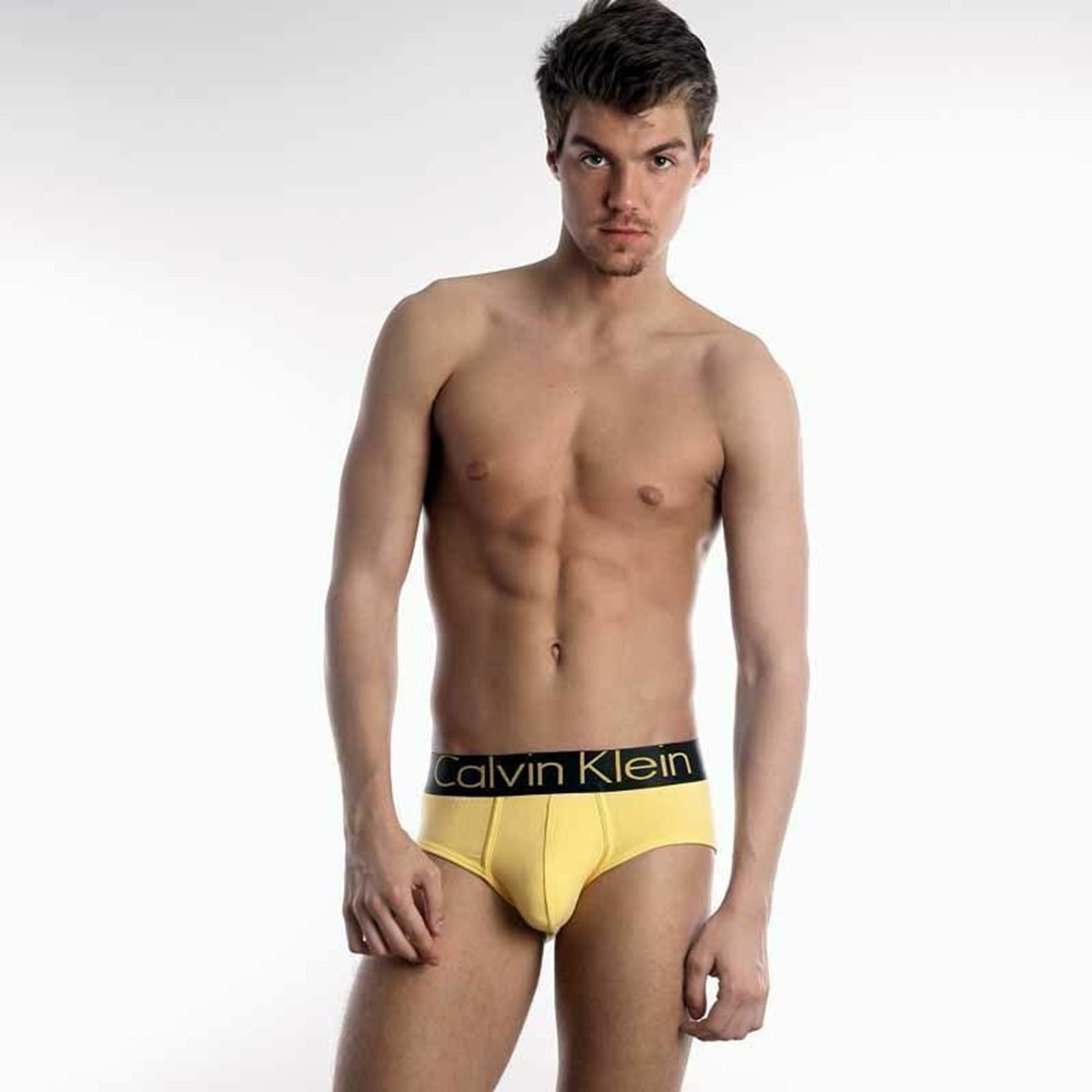 Мужские трусы брифы жёлтые с чёрной резинкой и жёлтыми буквами Calvin Klein Steel Black Waistband Yellow модал фото 1